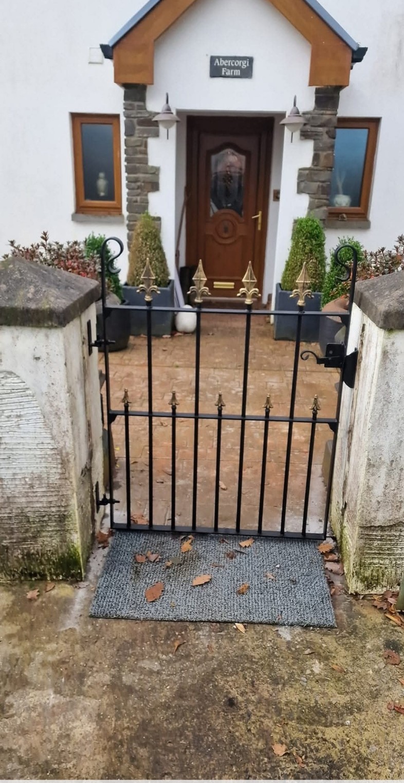 Black gate with brass finials, Abercorgi Farm