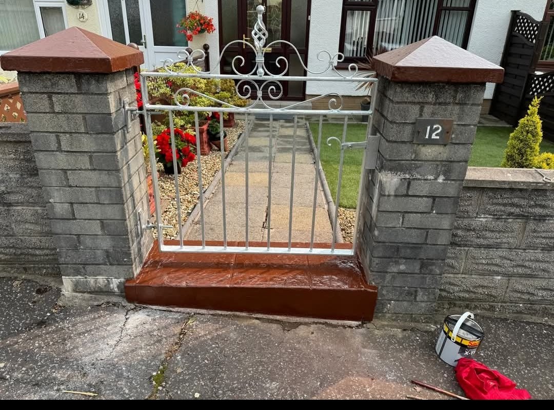 Driveway gate with rendered brick posts